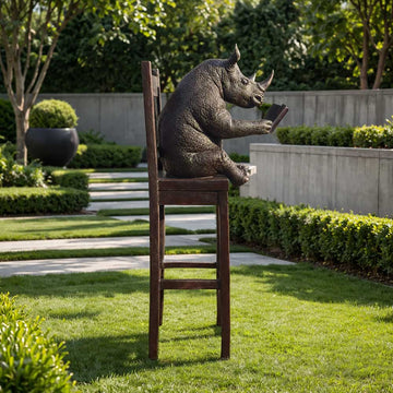 Rhino Above It All, Lost in a Good Story (Bronze Sculpture, Mid-Size)