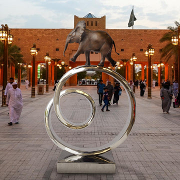 African Elephant Goes Round A Big World (Bronze Sculpture)