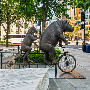 The Hippo and Red Wolf Race on the Bicycle (Bronze Sculpture)