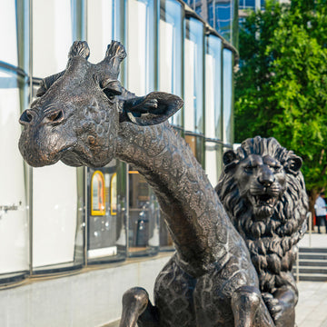 The Masai Giraffe and Lion Race on the Scooter (Bronze Sculpture)