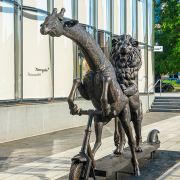 The Masai Giraffe and Lion Race on the Scooter (Bronze Sculpture)