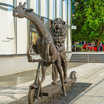 The Masai Giraffe and Lion Race on the Scooter (Bronze Sculpture)