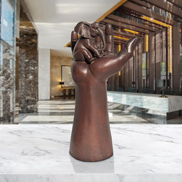 An Elephant up High in a Hand (Bronze Sculpture)
