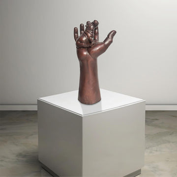 A Hippo up High in a Hand (Bronze Sculpture)