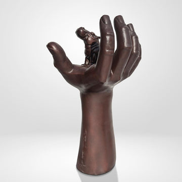 A Hippo up High in a Hand (Bronze Sculpture)