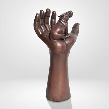 A Hippo up High in a Hand (Bronze Sculpture)