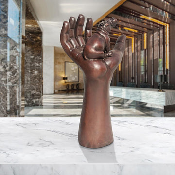 A Hippo up High in a Hand (Bronze Sculpture)