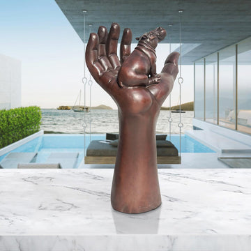 A Hippo up High in a Hand (Bronze Sculpture)