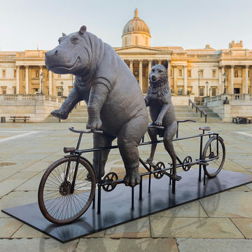 The Hippo and Red Wolf Race on the Bicycle (Bronze Sculpture)
