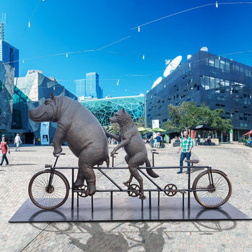 The Hippo and Red Wolf Race on the Bicycle (Bronze Sculpture)