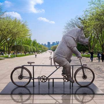 The Javan Rhino Races on the Bicycle (Bronze Sculpture)
