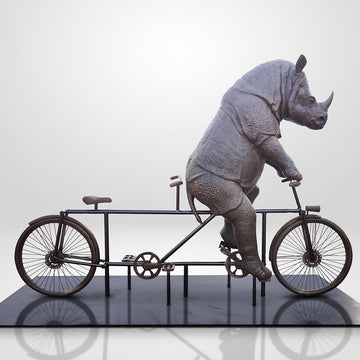The Javan Rhino Races on the Bicycle (Bronze Sculpture)