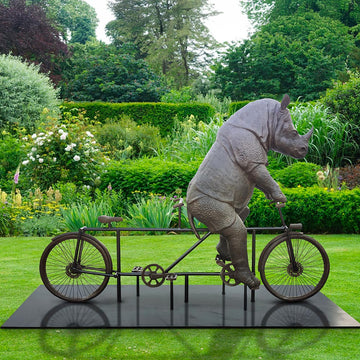 The Javan Rhino Races on the Bicycle (Bronze Sculpture)