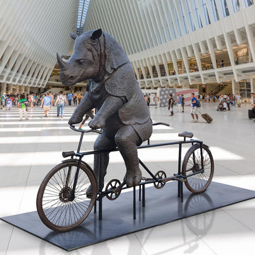 The Javan Rhino Races on the Bicycle (Bronze Sculpture)