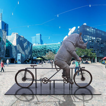 The Javan Rhino Races on the Bicycle (Bronze Sculpture)