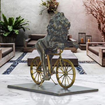 The Lion Races Against Time on the Bicycle (Bronze Sculpture, Small)