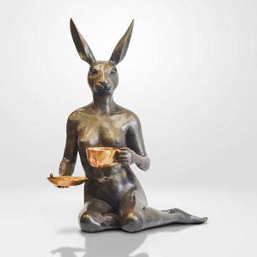 She looked into his eyes as she drank her cappuccino (Bronze Sculpture)