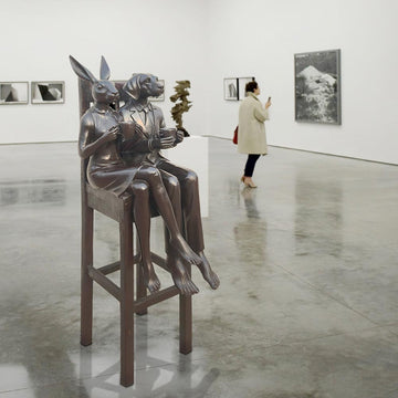 Rabbitwoman and Dogman Above It All, Savoring a Morning Brew (Bronze Sculpture, Mid-Size)