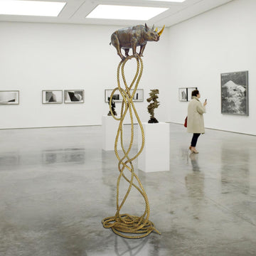 Golden Rhino Suspended on Rope and Feeling Very Safe (Bronze Sculpture)