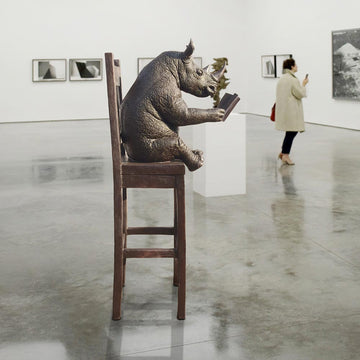 Rhino Above It All, Lost in a Good Story (Bronze Sculpture, Mid-Size)
