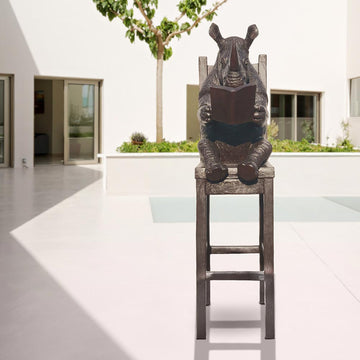 Rhino Above It All, Lost in a Good Story (Bronze Sculpture, Mid-Size)