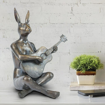 She Played the Songs That Made Her Happy (Bronze Sculpture)