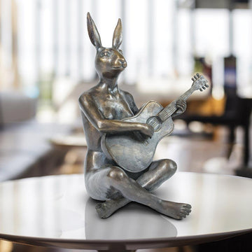She Played the Songs That Made Her Happy (Bronze Sculpture)