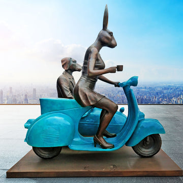 Together Side by Side on Blue Wheels (Bronze Sculpture)