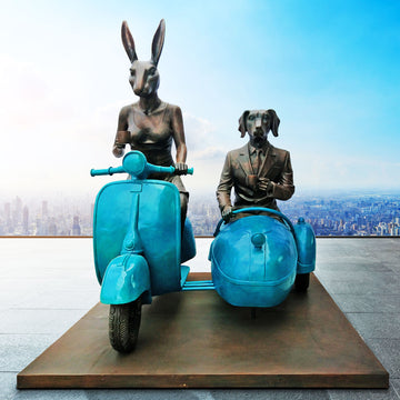 Together Side by Side on Blue Wheels (Bronze Sculpture)