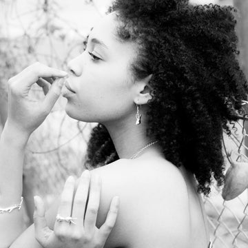 He whispered sweet nothings into her ears (Earrings)