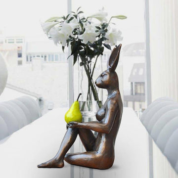 Rabbitwoman Thought a Pear in the Hand Is Worth Two in the Bush (Bronze Sculpture)