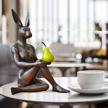 Rabbitwoman Thought a Pear in the Hand Is Worth Two in the Bush (Bronze Sculpture)