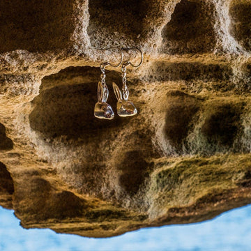 He whispered sweet nothings into her ears (Earrings)