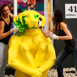 Neutral Bay’s big yellow dog to get some essential grooming from creators Gillie and Marc after vandals attack