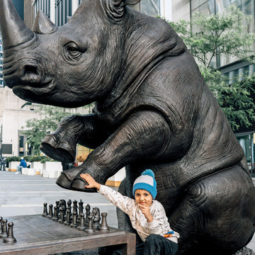 The White Rhino Was Thinking Ahead with Dogman's Encouragement (Bronze Sculpture)