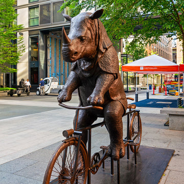 The Javan Rhino Races on the Bicycle (Bronze Sculpture)