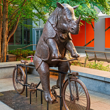 The Javan Rhino Races on the Bicycle (Bronze Sculpture)