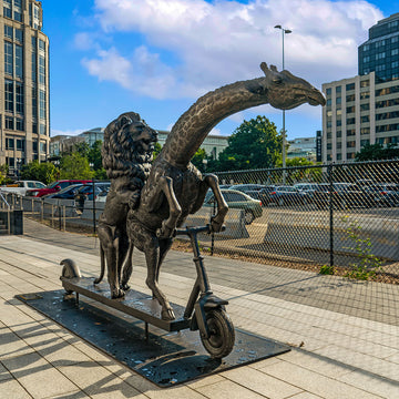 The Masai Giraffe and Lion Race on the Scooter (Bronze Sculpture)