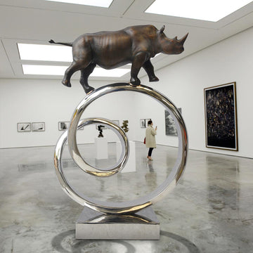 Black Rhino Goes Round A Big World (Bronze Sculpture)