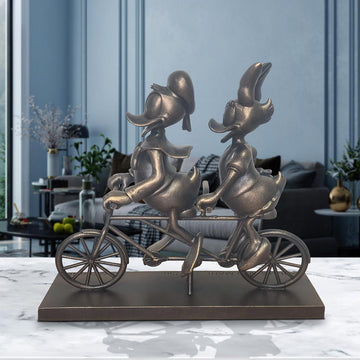 Daisy and Donald Take Love for a Spin (Resin Sculpture)