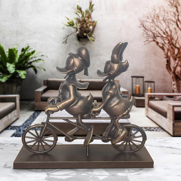 Daisy and Donald Take Love for a Spin (Resin Sculpture)