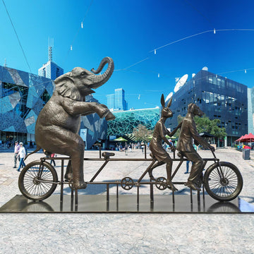 The African Elephant Was on a Wild Ride to a Safer Place with Rabbitwoman and Dogman (Bronze Sculpture)