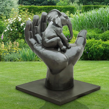 An Elephant in a Big Hand (Bronze Sculpture)