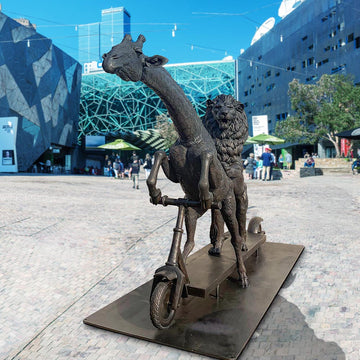 The Masai Giraffe and Lion Race on the Scooter (Bronze Sculpture)