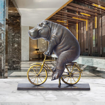 The Hippo Races Against Time on the Bicycle (Bronze Sculpture, Small)