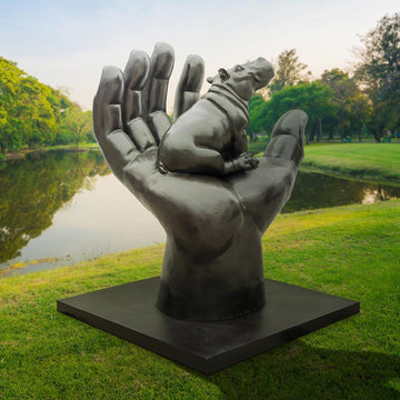 A Hippo in a Big Hand (Bronze Sculpture)