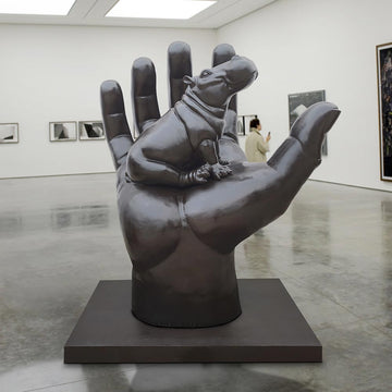 A Hippo in a Big Hand (Bronze Sculpture)