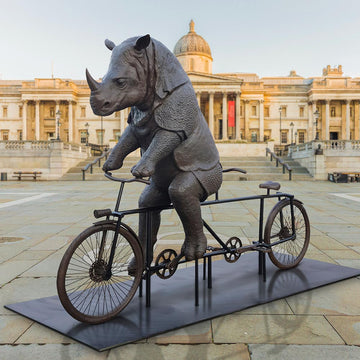 The Javan Rhino Races on the Bicycle (Bronze Sculpture)