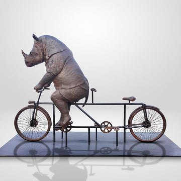 The Javan Rhino Races on the Bicycle (Bronze Sculpture)