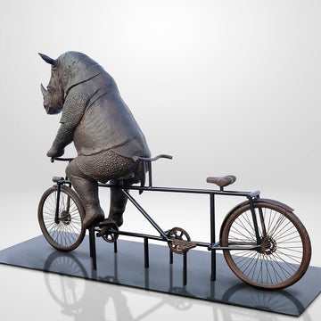 The Javan Rhino Races on the Bicycle (Bronze Sculpture)